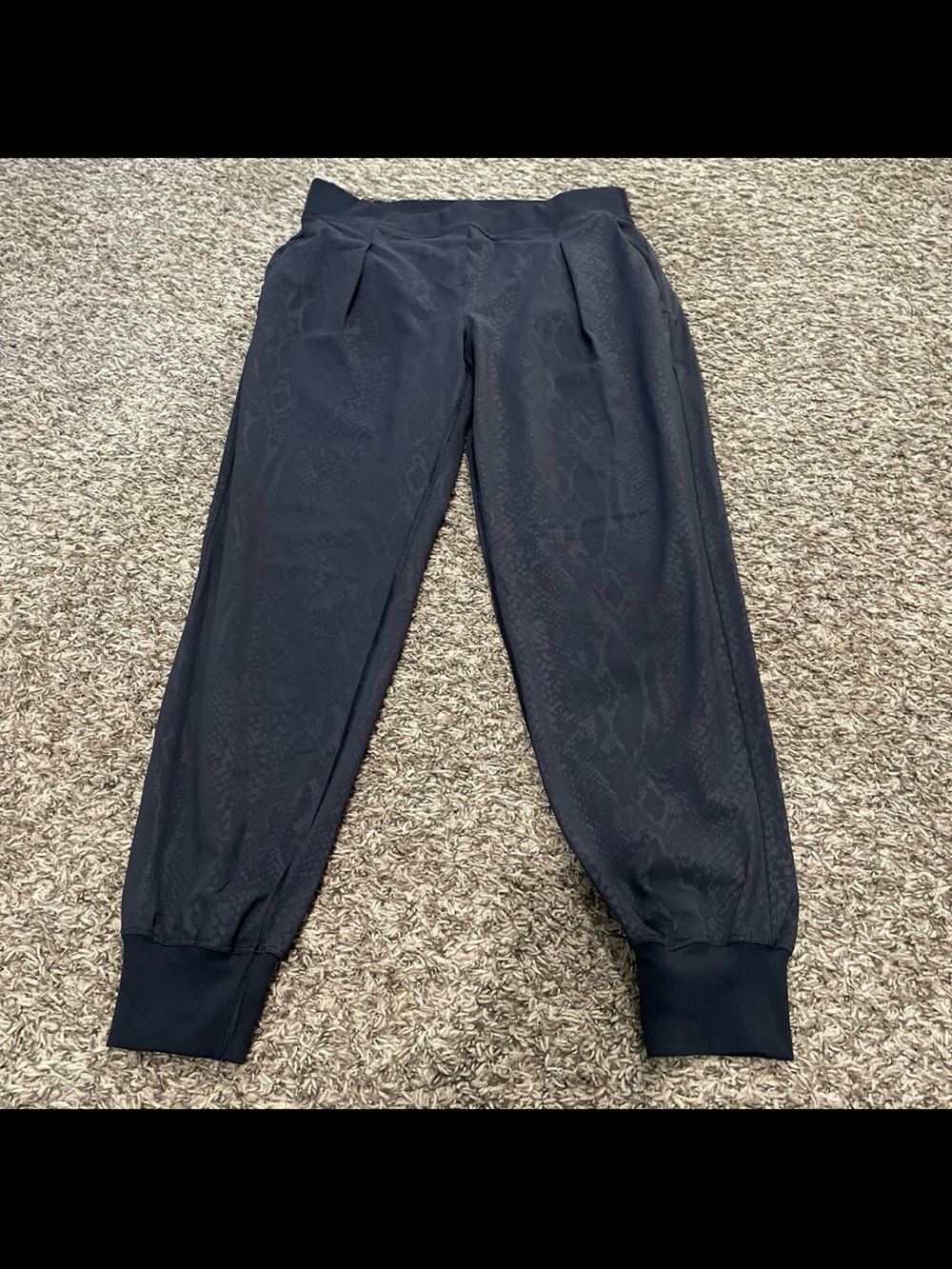 Lululemon yoga party pants, desert snake embossed black size 8